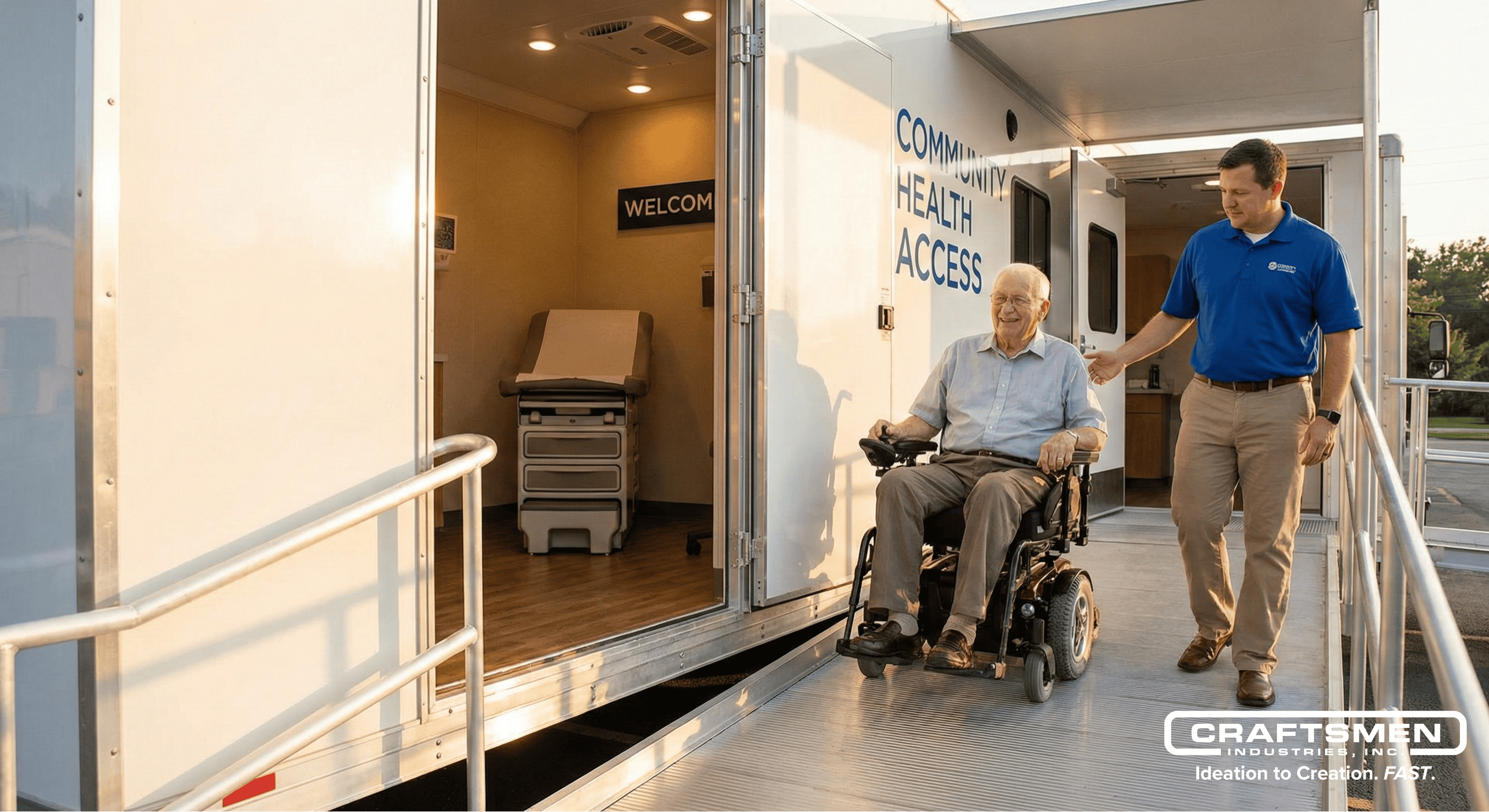Patient in wheelchair using ADA-compliant ramp to access medical trailer.