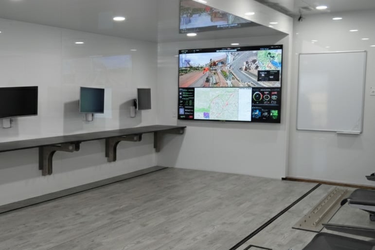 Rugged video walls and interactive displays in a mobile command unit, enabling teams to monitor live feeds and maps.