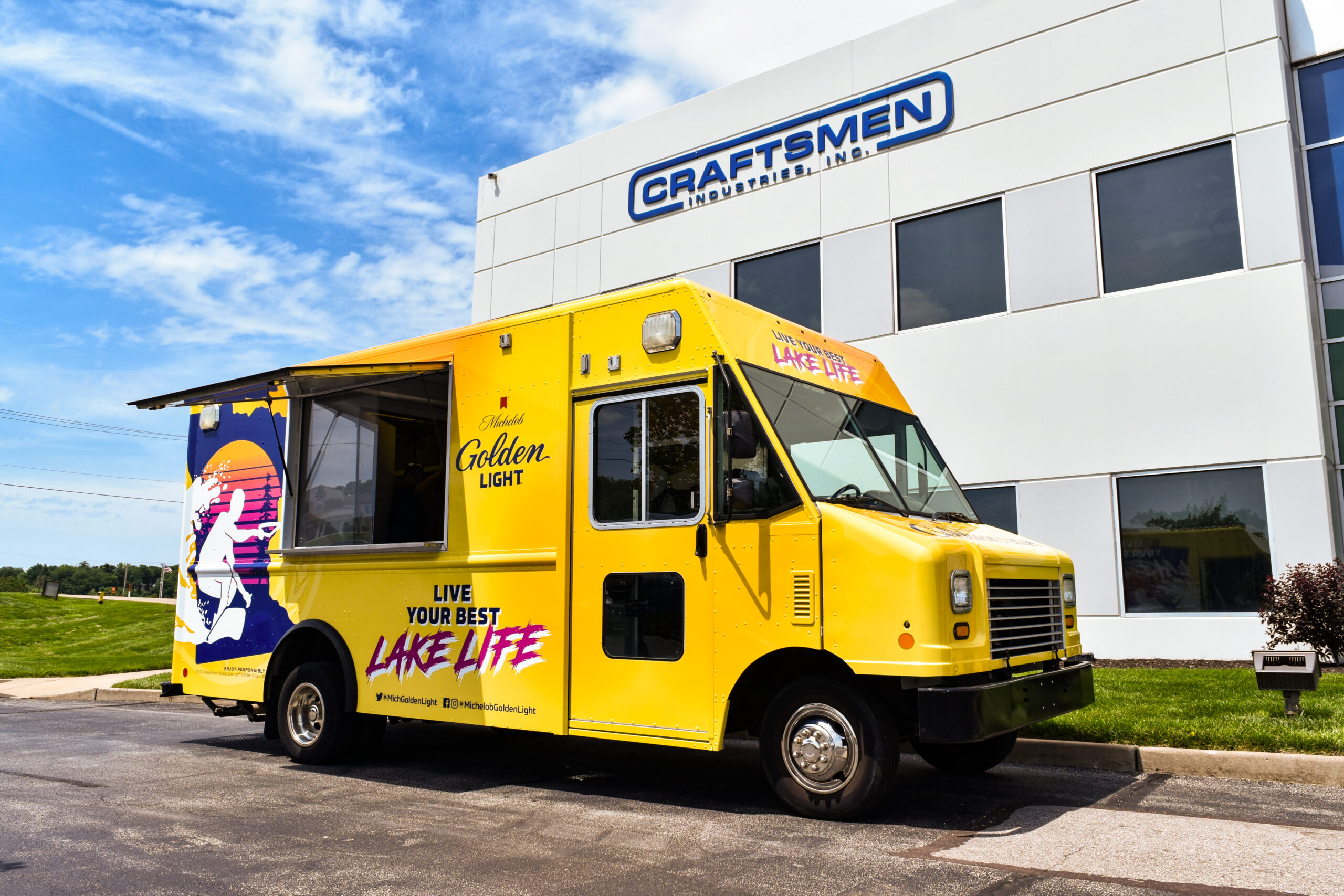 Full vehicle graphics wrap on bright yellow Miller Golden Light food truck by Craftsmen Industries