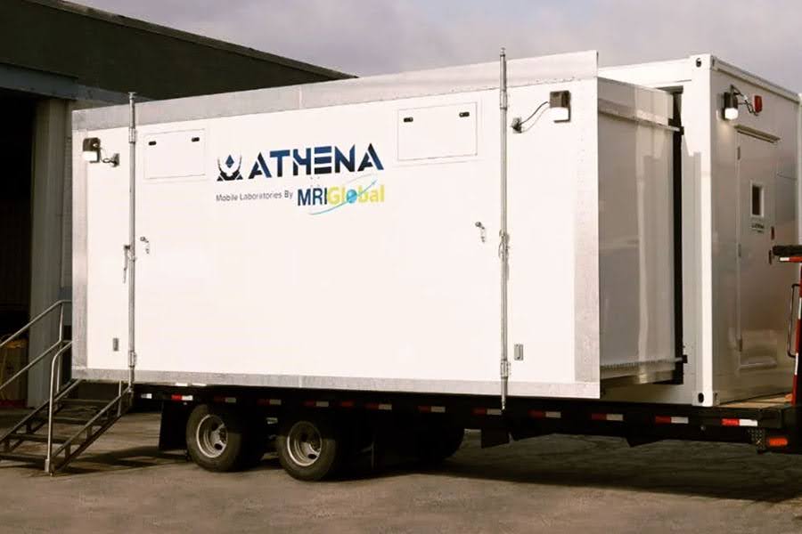 ATHENA Mobile Laboratories by MRI Global trailer with an expandable side section deployed and attached external stairs, used for mobile medical and research diagnostics.