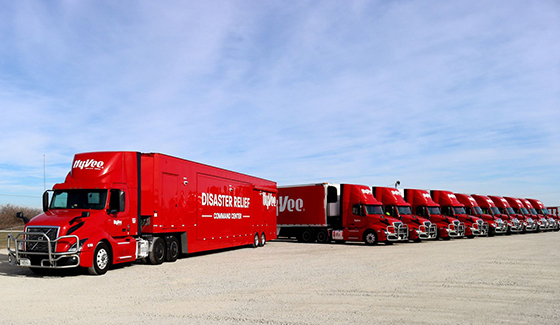 Long line of Hy-Vee Disaster Relief emergency response mobile command centers ready for disaster deployment