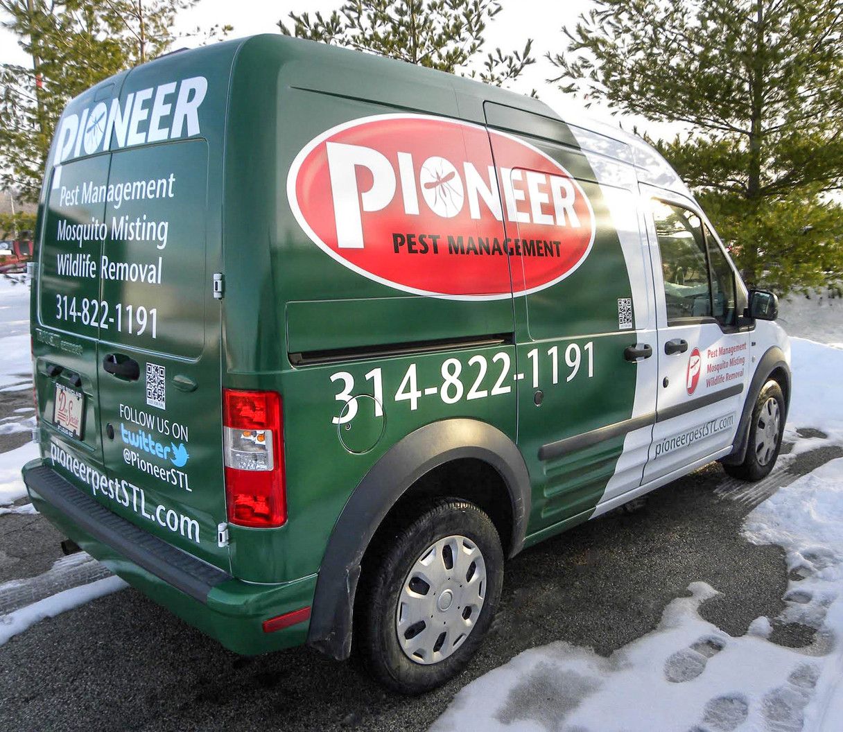 Rear and side view of a white commercial van with a full green Pioneer Pest Management vehicle wrap, displaying the company logo, phone number, and services like 'Mosquito Misting' and 'Wildlife Removal'.