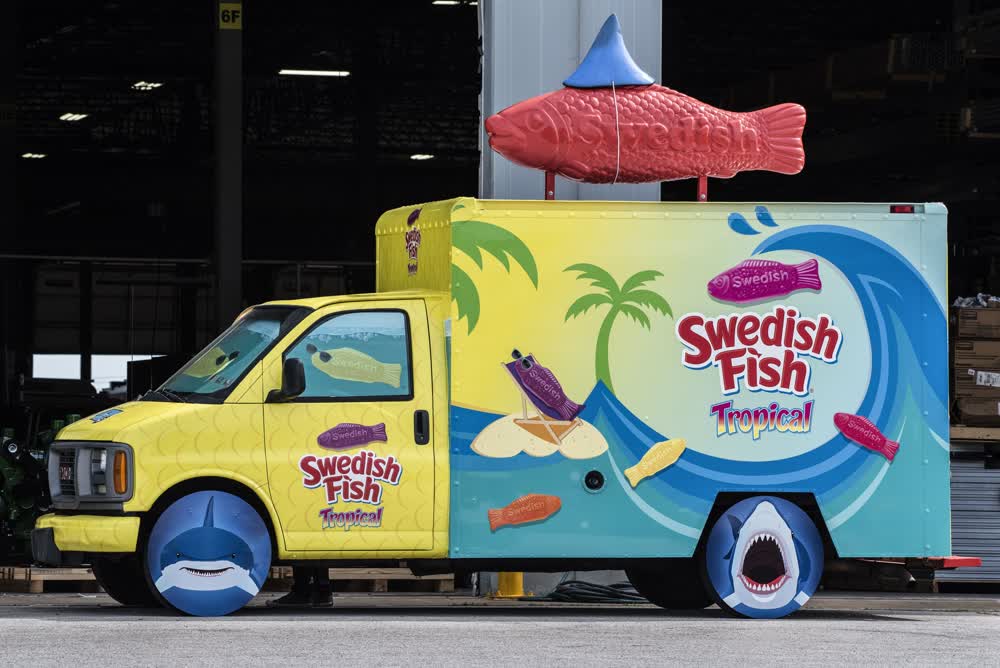 eye-catching promotional van with full wrap advertising Swedish Fish Tropical featuring a large 3D fish on the roof
