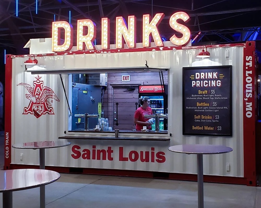 Illuminated bar container pop-up for drinks, featuring Budweiser branding, in Saint Louis.