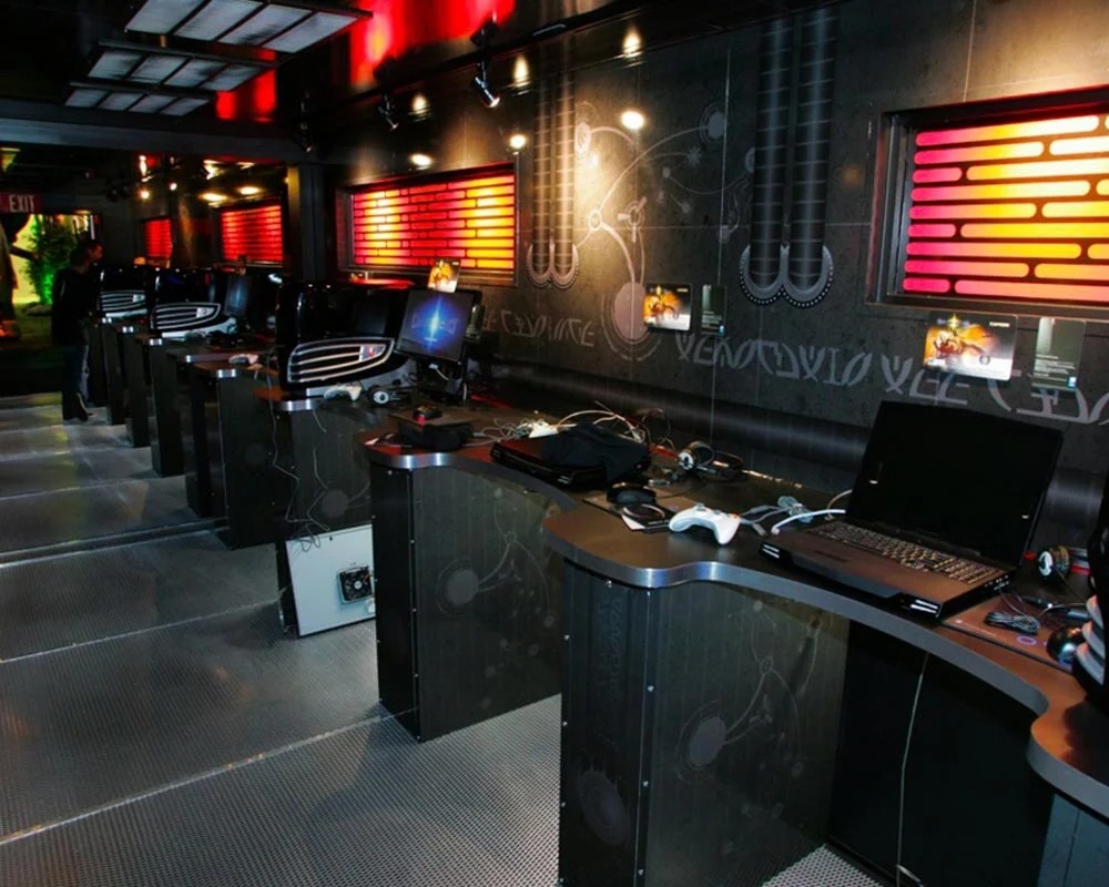 High-tech Alienware mobile gaming trailer interior with multiple PC and console workstations.