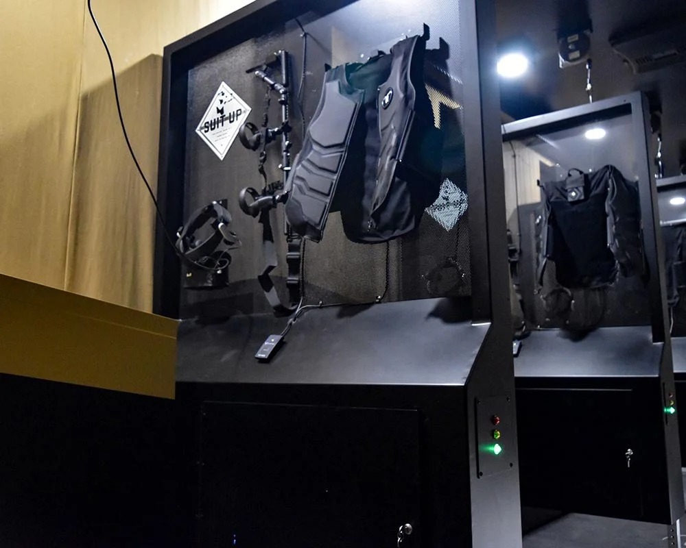 Tactical vests and VR equipment stored in a specialized