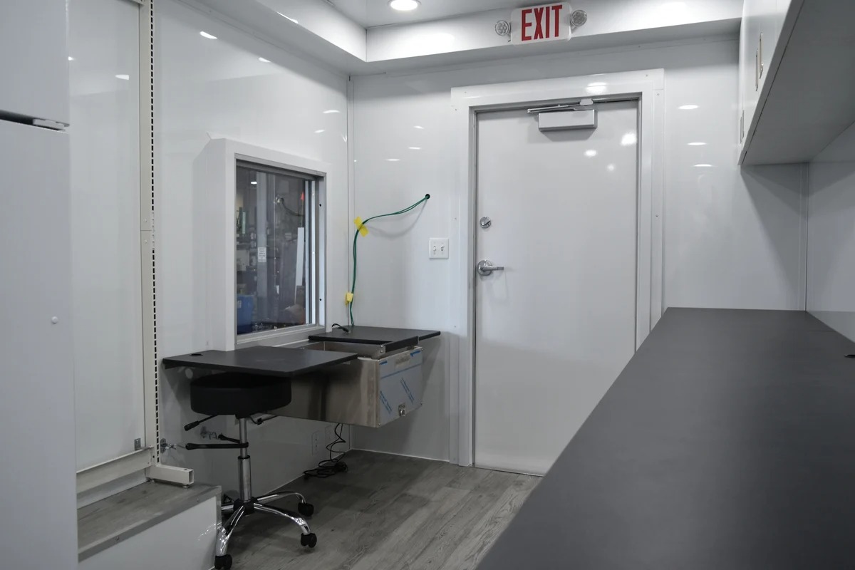 The interior of a Hy-Vee Pharmacy clinic, showing a clean and organized workspace.