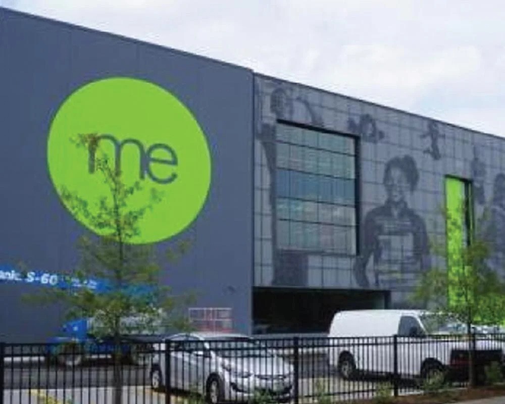 Charter school building exterior with large lime green