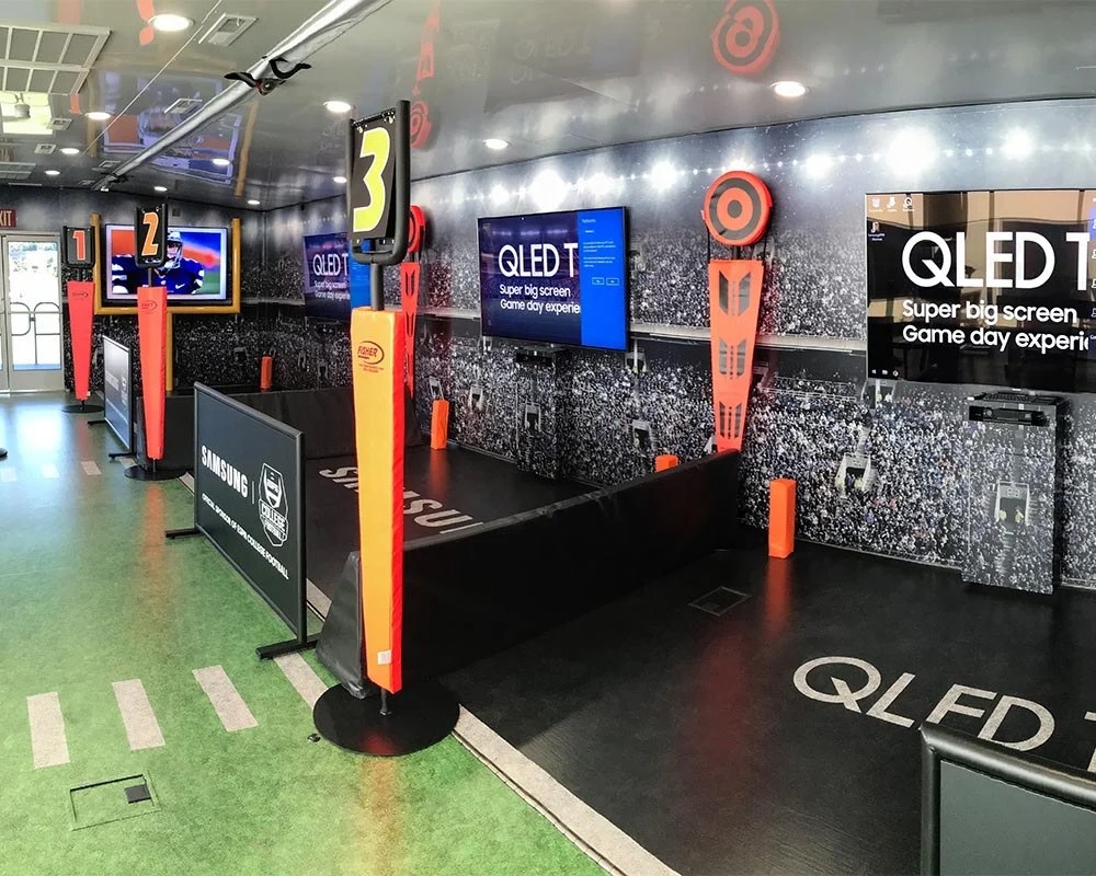 Samsung QLED TV mobile experience center interior designed as a football field for fan activation.