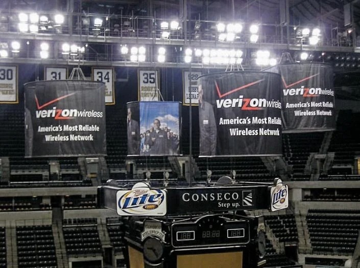 Close-up of a large Verizon Wireless banner graphic in a stadium, likely featuring the slogan 