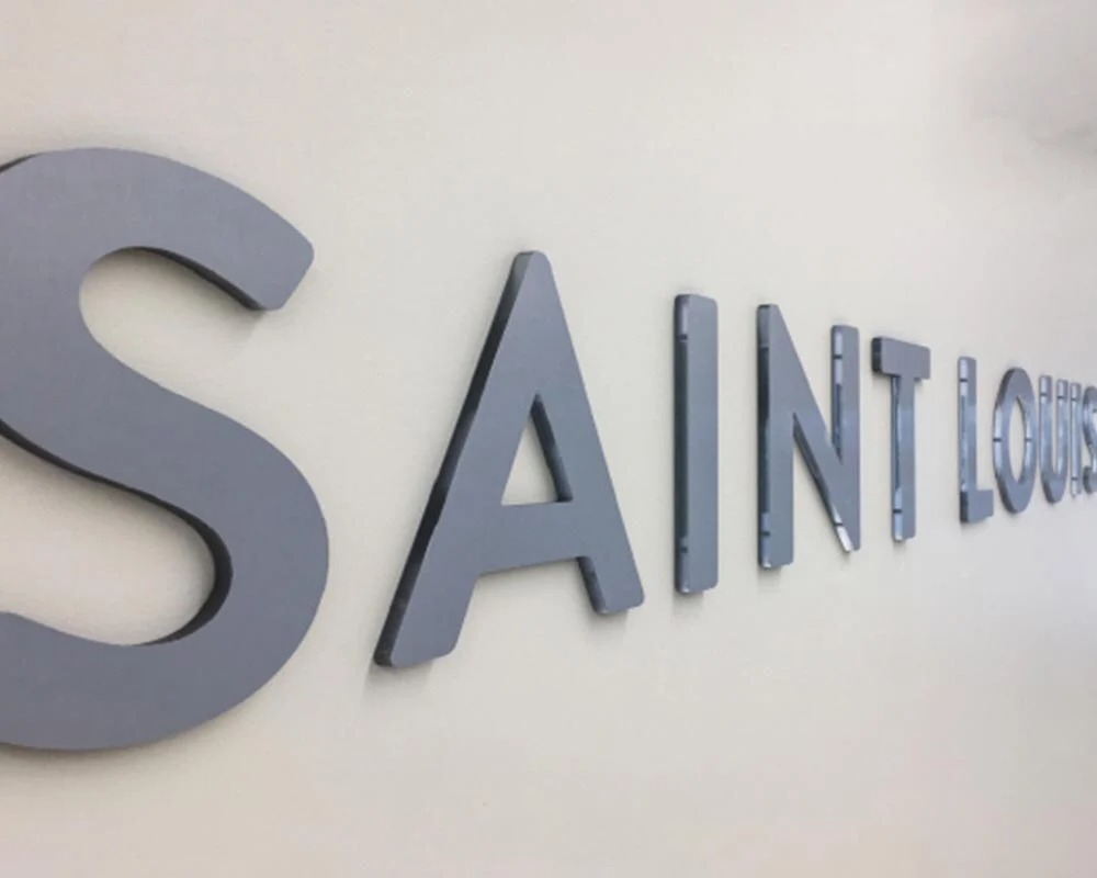 Saint Louis University (SLU) Hospital glass facade with large blue institutional crest architectural window film.