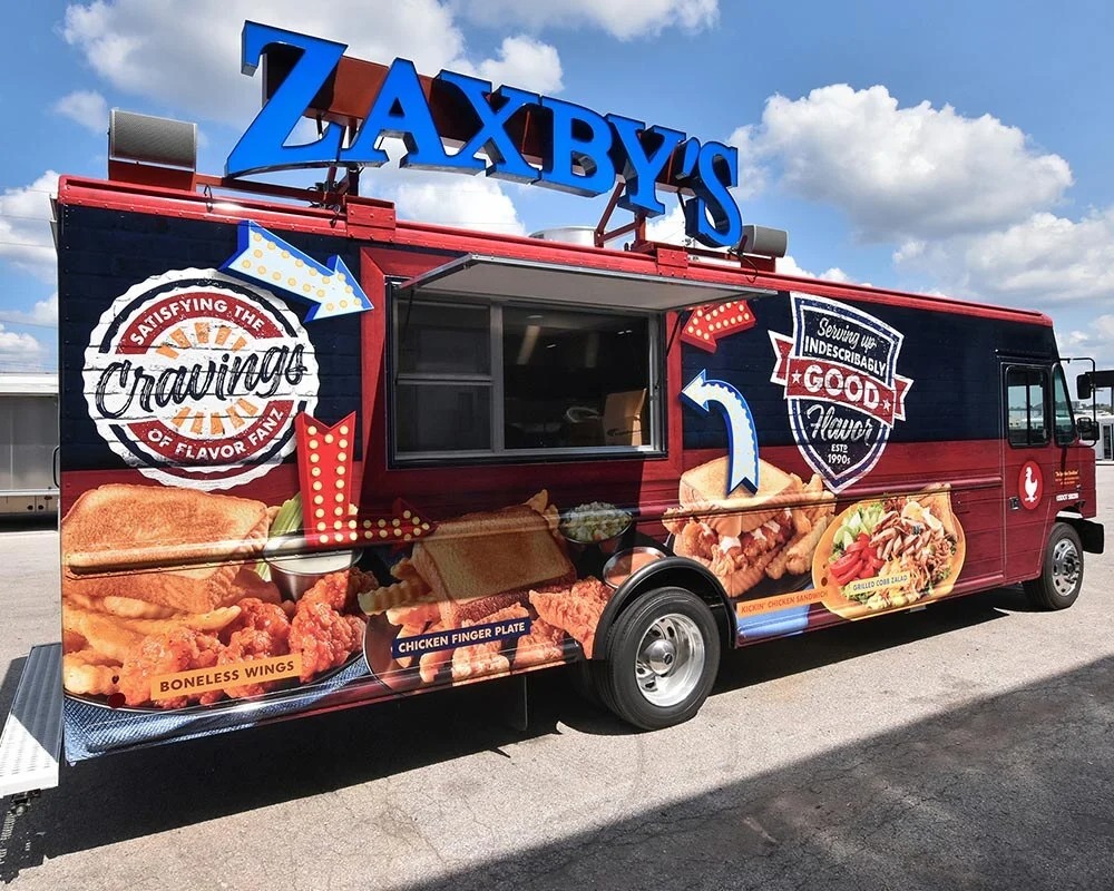 Zaxby's experiential food truck featuring a wrap of chicken finger plates, boneless wings, and sandwiches with the