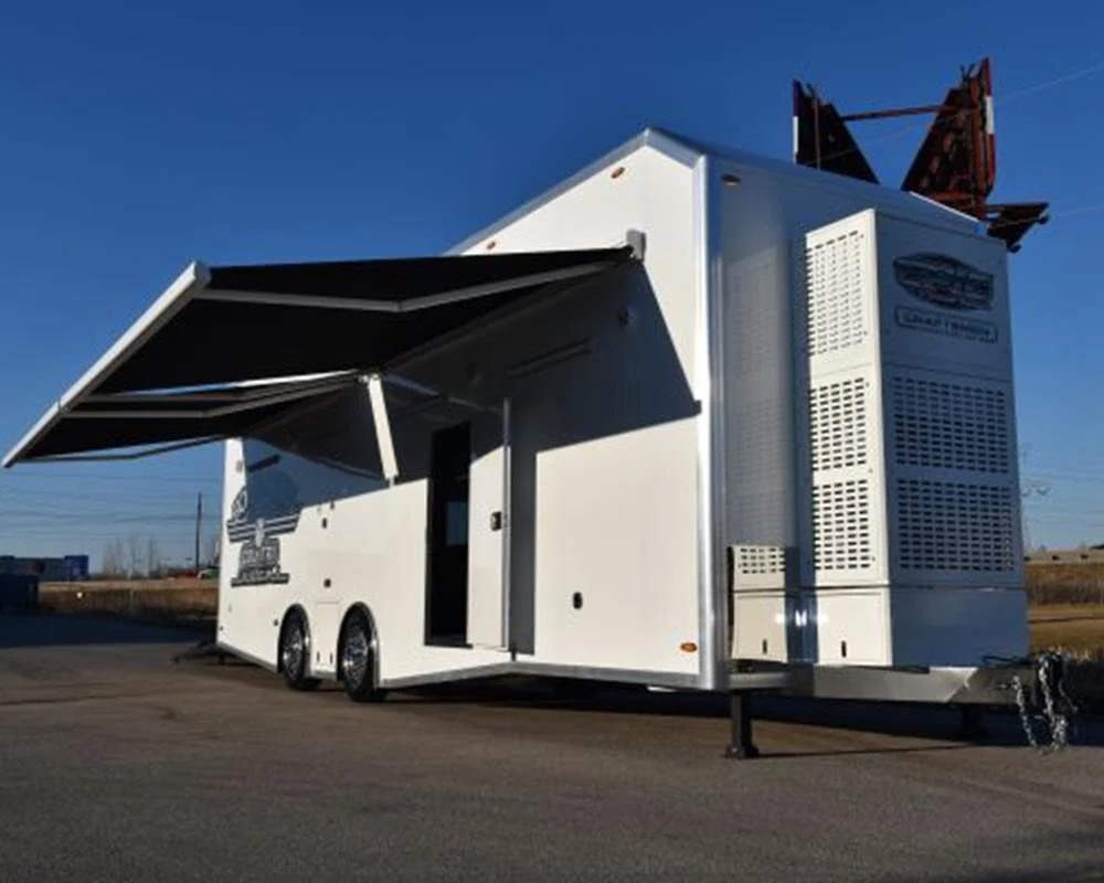Epic Wallace Southern Country Customs race car trailer front exterior view with side awning extended and generator compartment