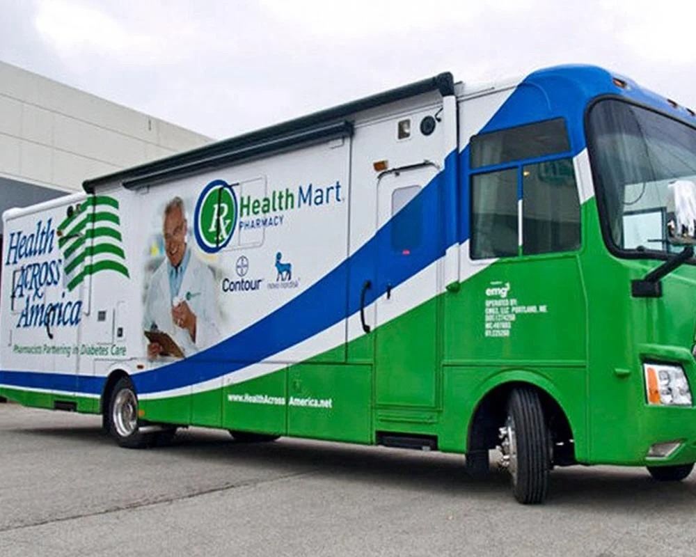Bud and Burgers two-story mobile marketing trailer at an outdoor festival, branded with