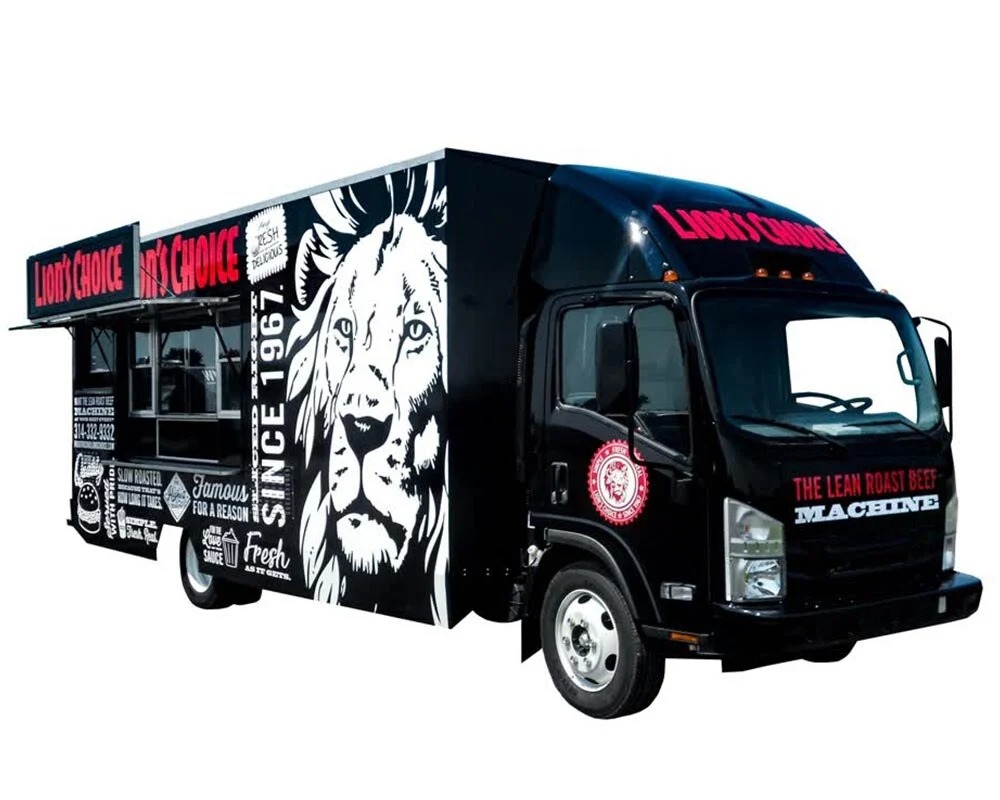 Black custom food truck for Lion's Choice with large white lion graphic and red text, built by custom food truck builders.