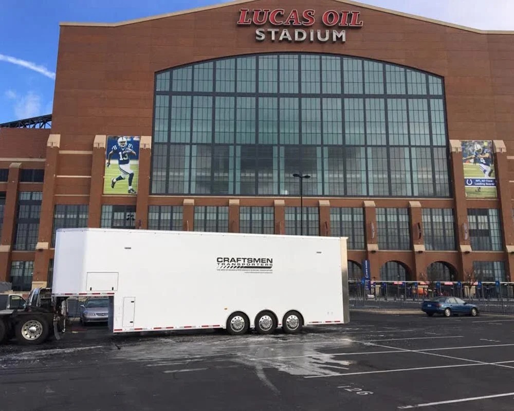 Craftsmen Trailers race car hauler parked outside Lucas Oil Stadium in Indianapolis