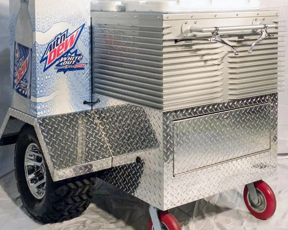 Mountain Dew White Out cooler cart with metallic ribbed siding and diamond plate base for an experiential event.