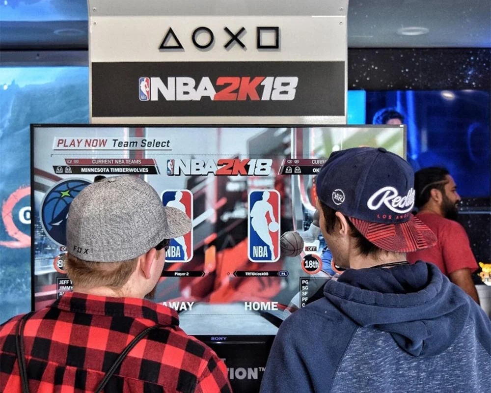 Custom video game roadshow trailer interior featuring a dark, immersive God of War retail display.