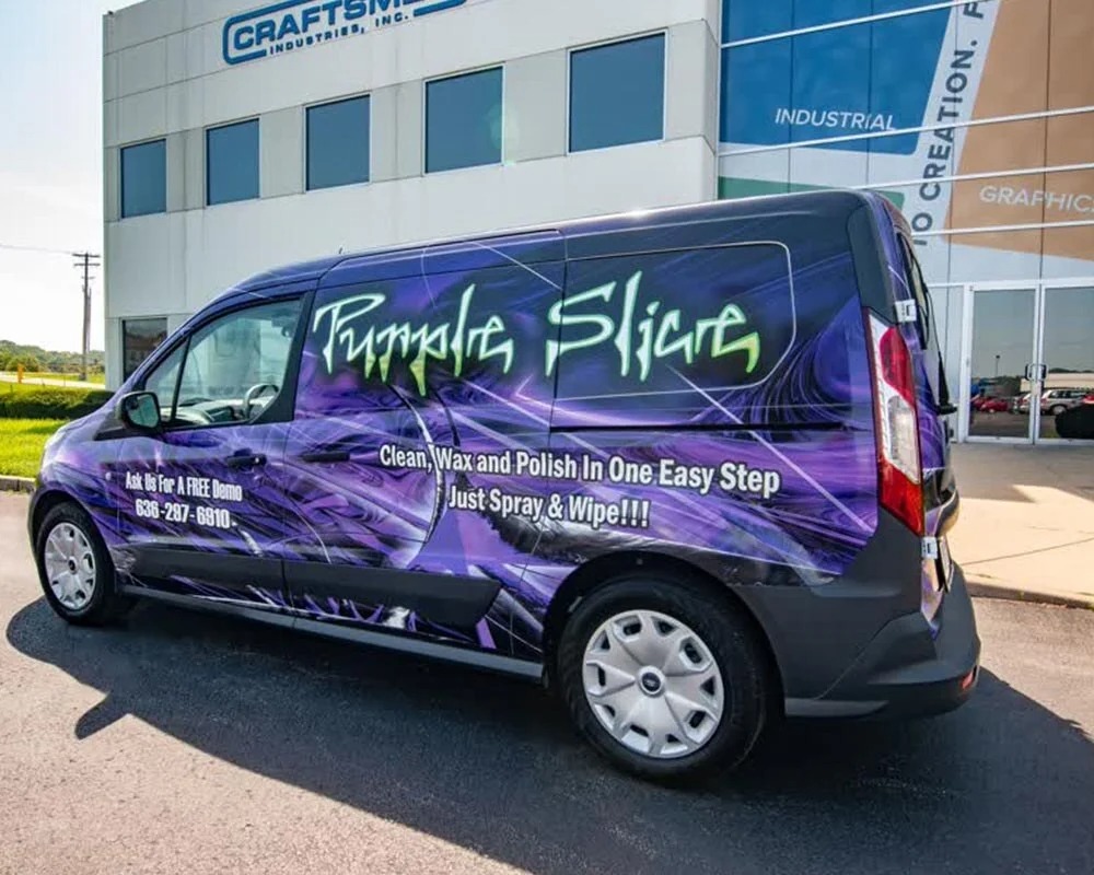Purple Slice mobile billboard van with a purple, black, and green wrap promoting