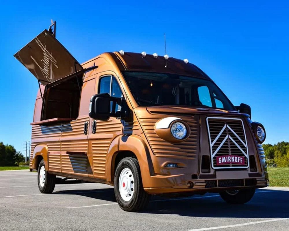 Smirnoff branded promotional van designed for outdoor events and mobile marketing, featuring an open serving window and custom vintage-style exterior.