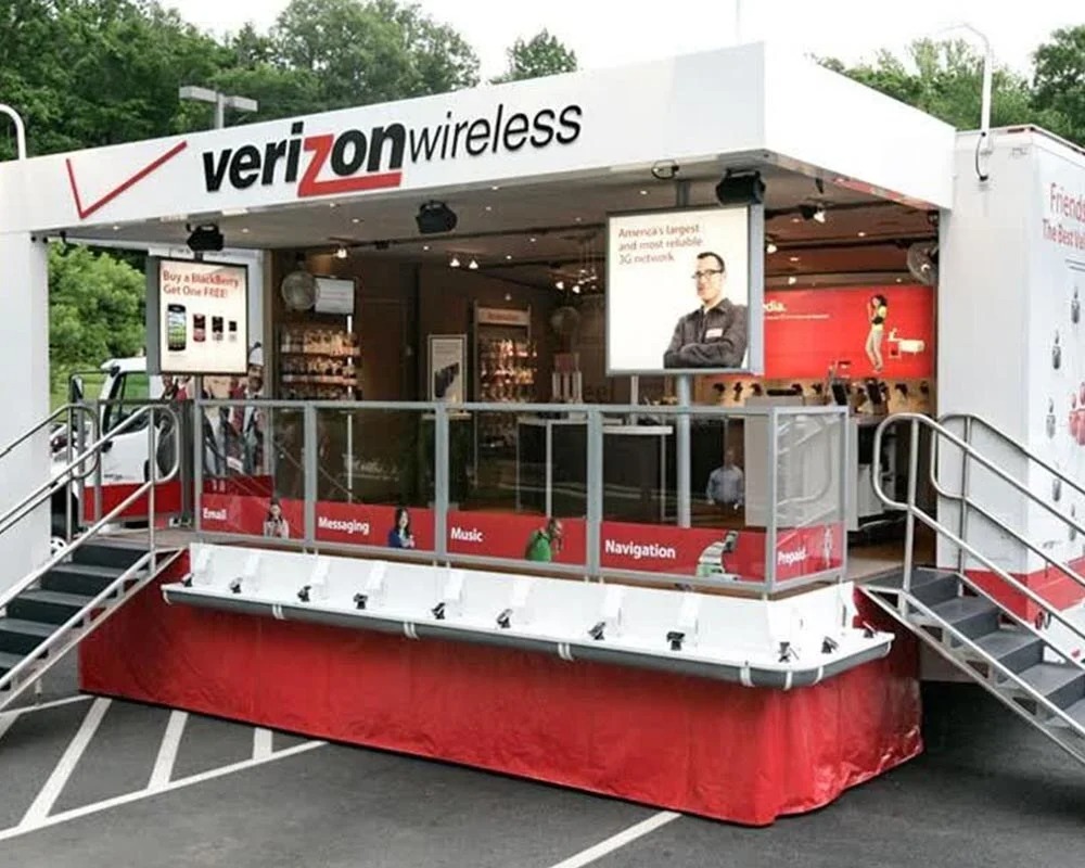 Verizon Wireless promotional event trailer featuring interactive displays and branded graphics for mobile technology marketing and customer engagement.