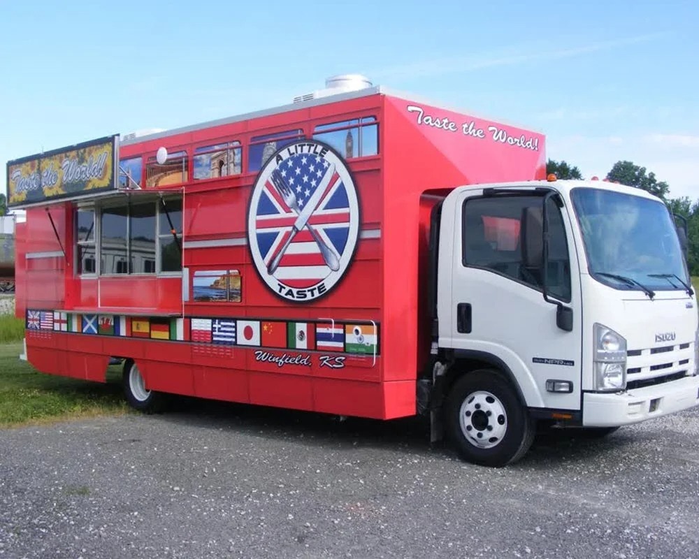 Branded food truck with custom fleet graphics exposed to direct sunlight, illustrating performance in extreme heat, cold, and UV conditions.